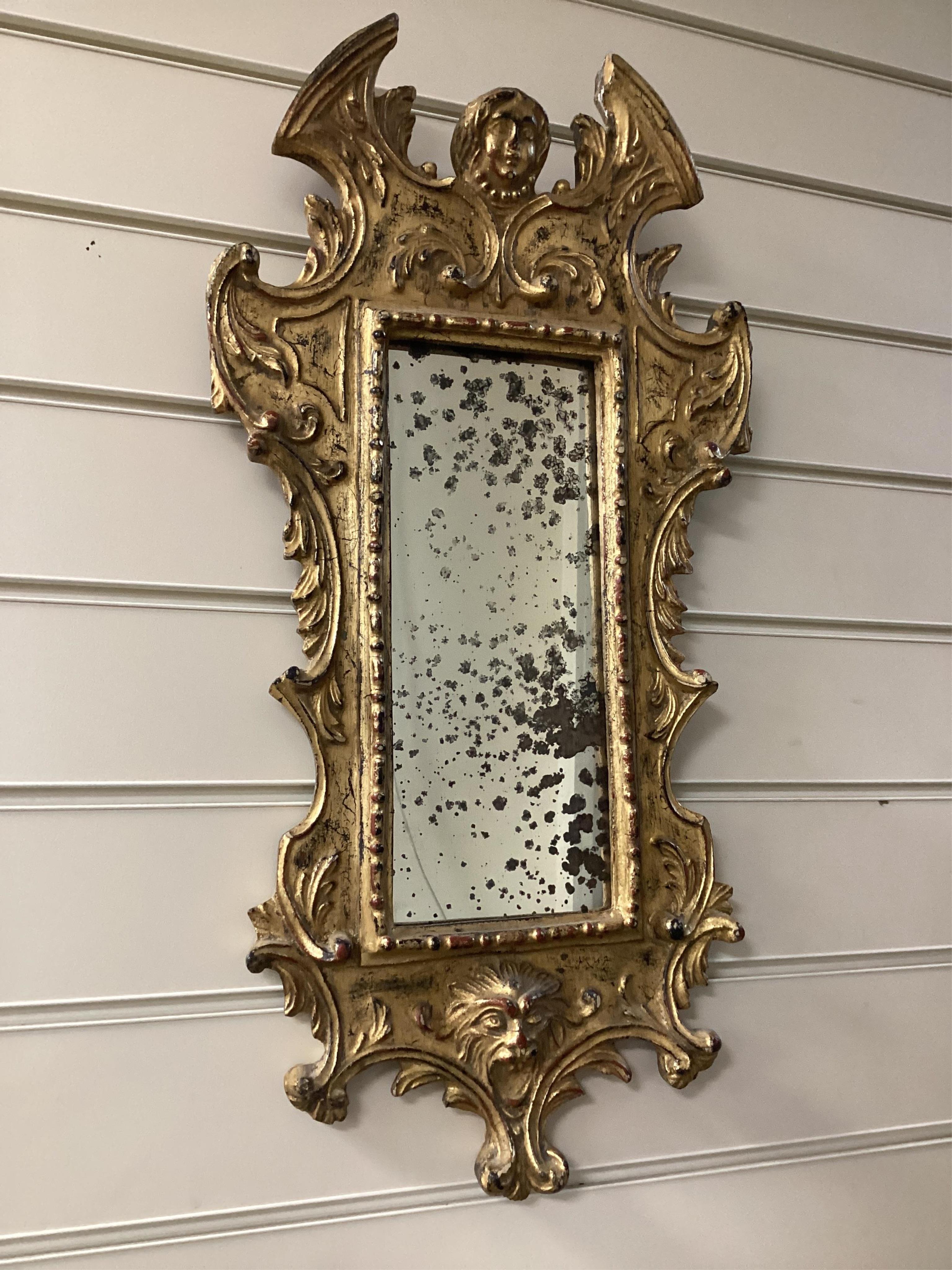 A small 18th century style Florentine design wall mirror, width 30cm, height 60cm. Condition - good